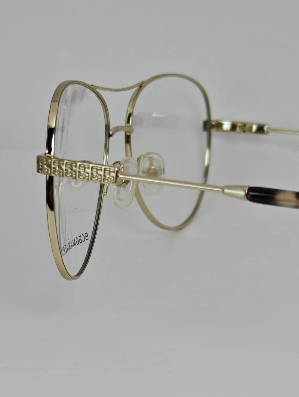 BCBGMAXAZRIA Call Aviator Eyeglass Frames in Black and Gold. Feminine.